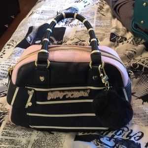 Mini Betsey Johnson satchel with pom pom keychain.